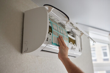 Dirty air conditioner filter need cleaning. Air conditioner service, repair and clean equipment.