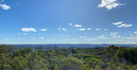 View of the island's coastline from the top of a mountain. Mountain top with view of the city below.