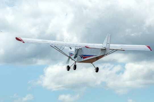 Experimental single-engine plane taking off shown from the back