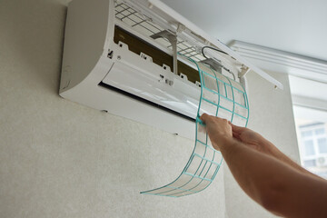 Dirty air conditioner filter need cleaning. Air conditioner service, repair and clean equipment.