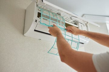 Dirty air conditioner filter need cleaning. Air conditioner service, repair and clean equipment.