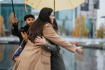 Emotional reunion of friends in rainy urban setting with yellow umbrella.