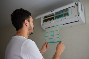 Dirty air conditioner filter need cleaning. Air conditioner service, repair and clean equipment.