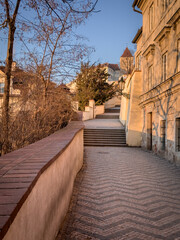 Fototapeta na wymiar Morning journey up the Castle steps to Prague Castle. Winter twilight at dawn. Prague, Czech Republic