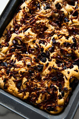 Focaccia with caramelized onions, anchovies and black olives. Italian snacking bread