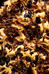 Focaccia with caramelized onions, anchovies and black olives. Italian snacking bread