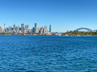 View of Sydney and its iconic buildings, skyscrapers and bridge at the distance. Australian city on...