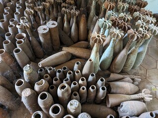 Fototapeta premium unexploded land mines and cluster bombs remains picked up all around Cambodia after war,now set in Museum of landmines in Siem Reap Cambodia, huge amount of ammunition is still laying in countryside