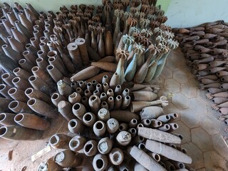 unexploded land mines and cluster bombs remains picked up all around Cambodia after war,now set in...