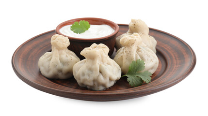 Tasty khinkali (dumplings) with sauce and spices isolated on white. Georgian cuisine