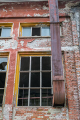 old decaying building with broken windows