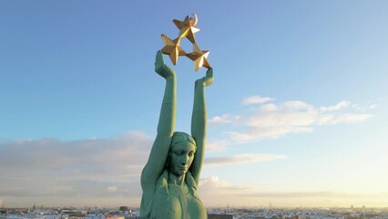 Statue of liberty Milda. The symbol of freedom of Latvia. Beautiful aerial view of Riga city - the capital of Latvia.