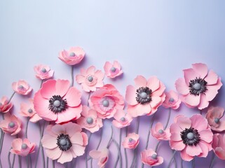 pink anemones paper flowers minimal decoration on pastel blue backdrop with copy space top. Beauty salon, hobby, art studio invitation or flyer template mockup.