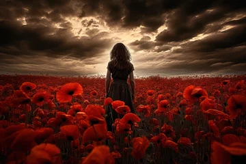 Sierkussen woman in red poppy flowers field in spring or summer with stormy sky. Dramatic landscape. Relationship, psychology, therapy concept.  © Dina