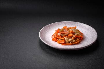 Delicious fresh stew with chicken or turkey with slices of sweet pepper and carrots