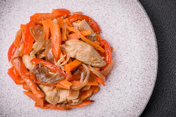 Delicious fresh stew with chicken or turkey with slices of sweet pepper and carrots