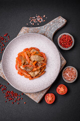 Delicious fresh stew with chicken or turkey with slices of sweet pepper and carrots