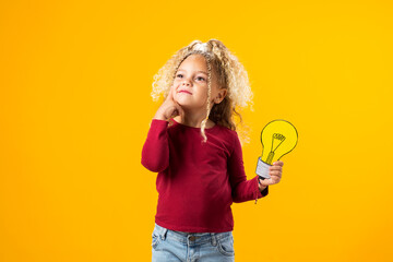 Idea Illumination. Child girl Genius with Paper Bulb.