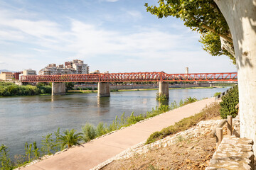 the red railway bridge (Green Way) over Ebro river in Tortosa, comarca of Baix Ebre, Province of Tarragona, Catalonia, Spain
