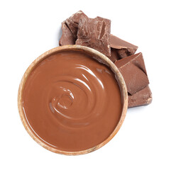 Tasty milk chocolate paste in bowl and pieces isolated on white, top view
