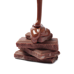 Pouring tasty milk chocolate paste onto pieces isolated on white