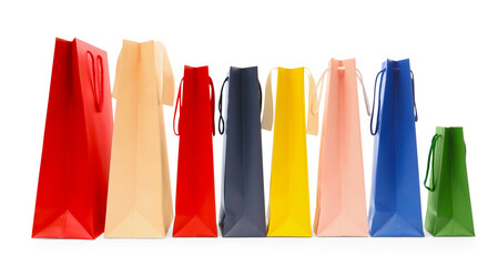 Many colorful paper shopping bags isolated on white
