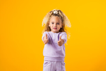 Child Girl Expressing Positivity with a Thumbs-Up Gesture ? Encouraging Success and Uplifting Vibes