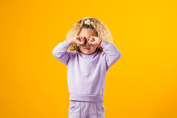 Crying girl with hands covering her eyes. Negative emotion, depression, stress concept.