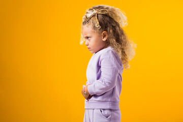 Child girl feeling abdominal pain, keeping hands on stomach because indigestion, painful illness feeling unwell. Ache concept. - obrazy, fototapety, plakaty