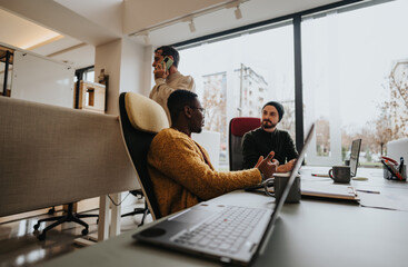 Multicultural team working together in a modern office environment.