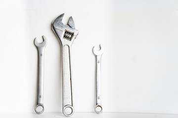 plumbing repair tool kit on white background, screwdriver, adjustable wrench, adjustable wrench, plumber's tool kit