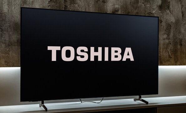 Flat-screen TV set displaying logo of Toshiba