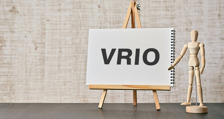 There is notebook with the word VRIO. It is an abbreviation for Value, Rarity, Inimitability,...