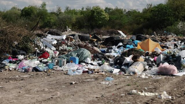 Overwhelming heap, Pollution problems, Waste management. Expanse land is overwhelmed with heaps trash, depicting distressing scene environmental neglect and urgent need for waste management reform.