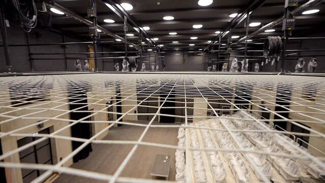 Staedicam Wide Shot of Tension Wire Grid Floor in the Theater Hall