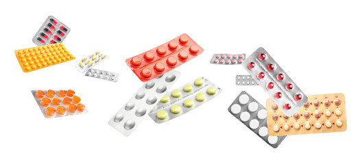 Many flying blister packs with pills on white background