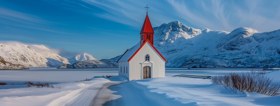 A red and white chapel amongst the snowy mountains of Norway.