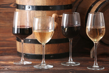 Glasses of different exquisite wine on wooden background, closeup