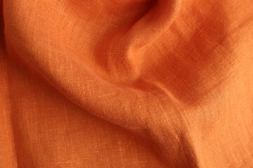 Texture of beautiful orange fabric as background, closeup