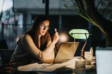 Businesswoman discussing strategies for profit growth and market expansion in an office. Analyzing statistics and planning tasks for a successful project.