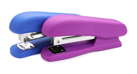 Two new bright staplers isolated on white