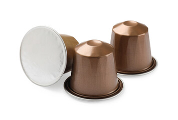 Three plastic coffee capsules isolated on white