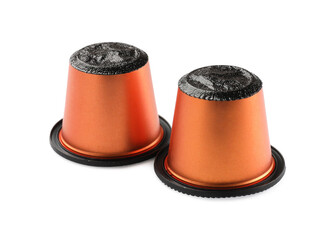 Two plastic coffee capsules isolated on white