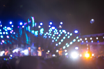 The night is alive with music and excitement at a concert festival main event. A cheering...
