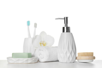 Fototapeta na wymiar Bath accessories. Different personal care products and flower on table against white background