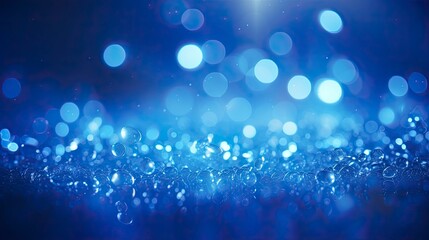 blue glow particle abstract bokeh background 