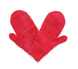 Pair of red warm knitted mittens on white background