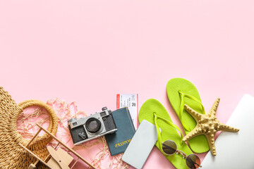 Composition with beach accessories, passport, ticket and gadgets on pink background