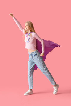 Female superhero with symbol of woman on pink background