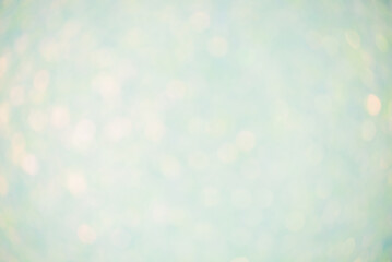 Light blue blurred defocused abstract background. White defocus lights. Glitter defocus.
